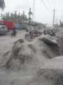 Merapi rocks-ash down the road Yogya-Magelang, 01082011 Fetty